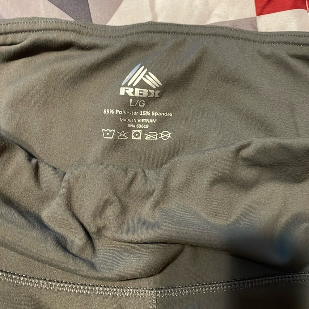 RBX large leggings pockets on both sides a greenish color
